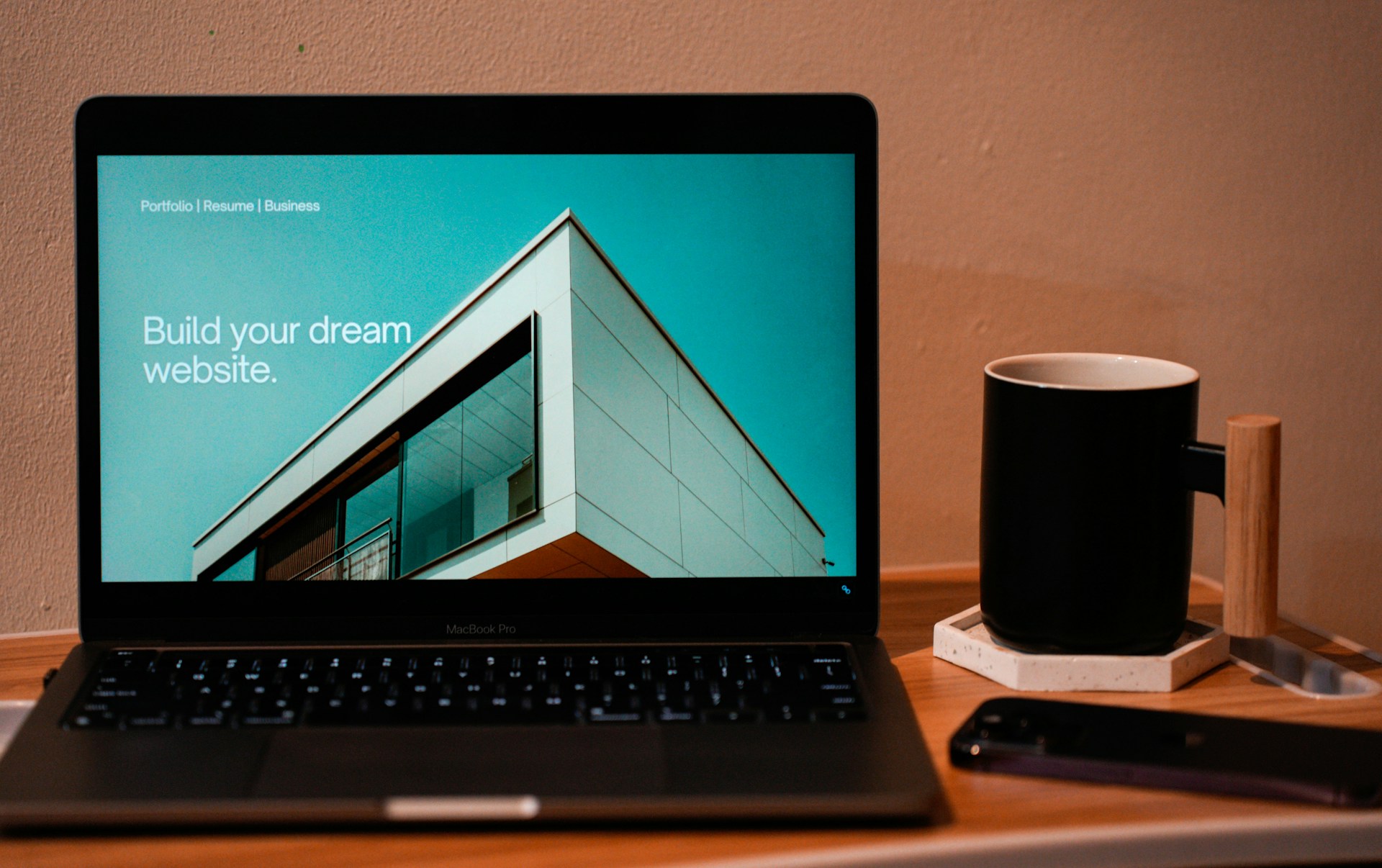 Suggested photo: owner reviewing a new homepage on a laptop